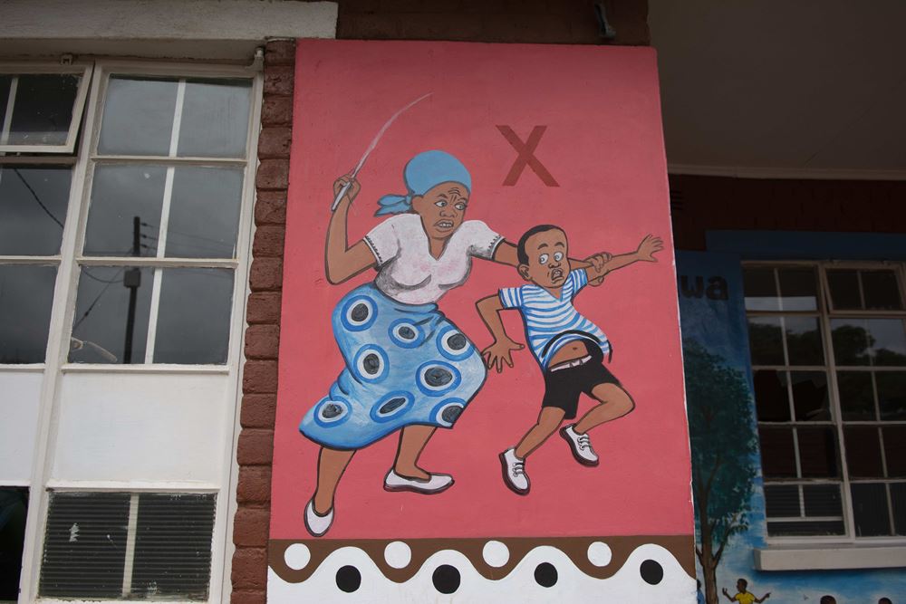 Mural in Tikondane project: It is forbidden to hit your child!